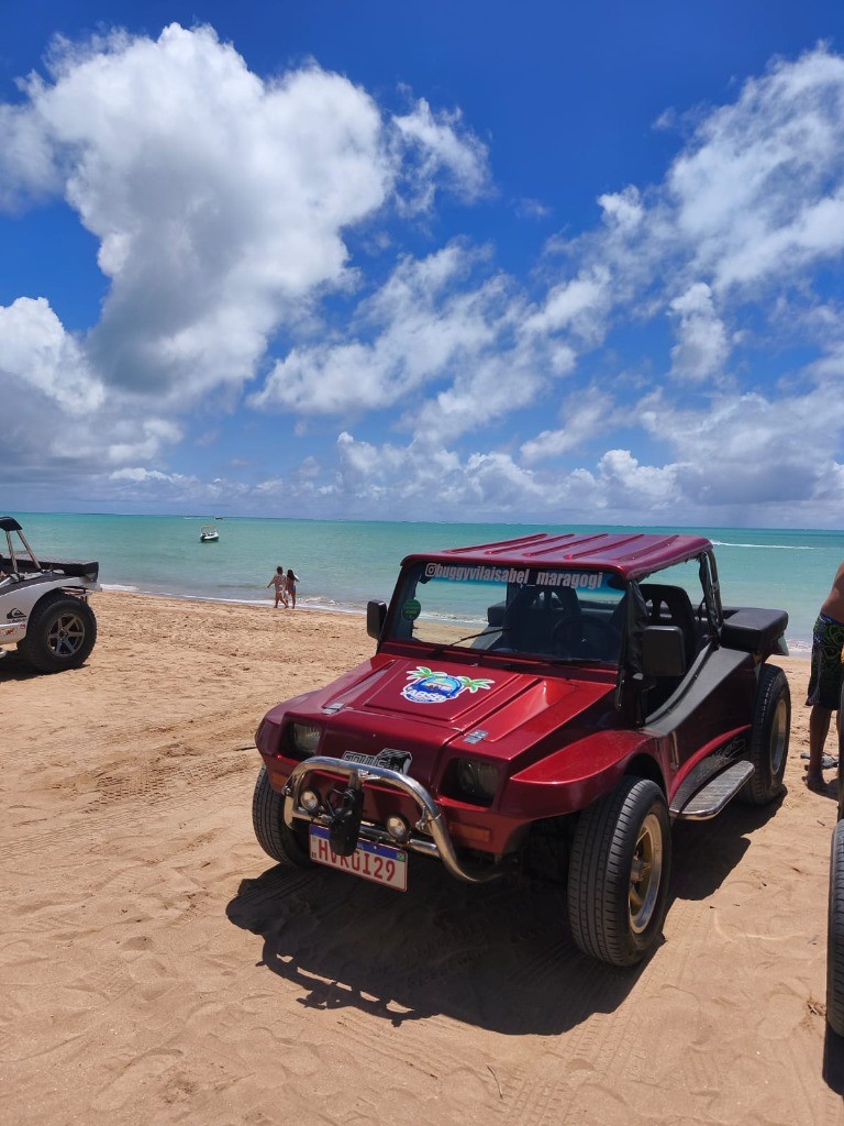 Buggy Vila Isabel nas areias douradas e mar verde-esmeralda